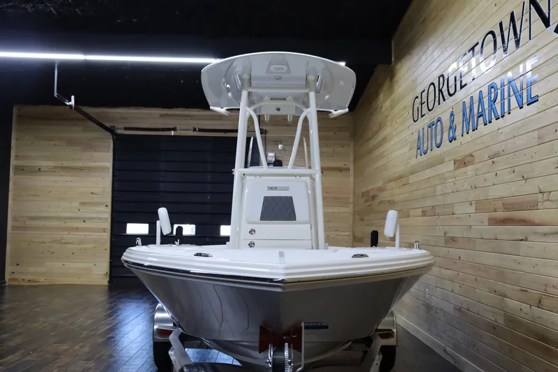 Slide: The Image of 2024 Pathfinder 2200 TRS boat displayed at Georgetown Auto & Marine showroom. - 6