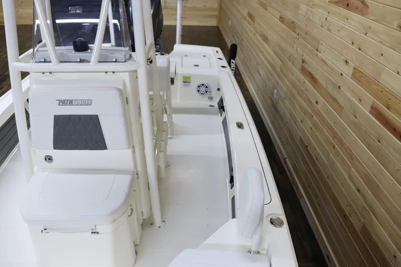 Slide: The Image of 2024 Pathfinder 2200 TRS boat interior with seating and storage compartments. - 9