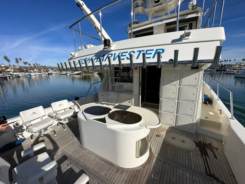 Slide: The Image of 2009 Little Hoquiam 68 Long Range Sportfisher boat deck with fishing equipment and seating. - 16