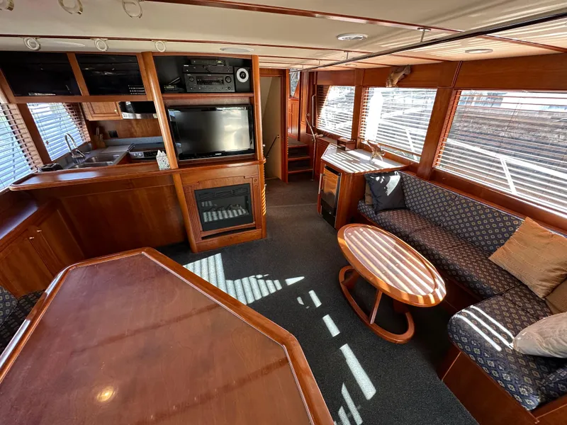 Slide: The Image of Interior of 2009 Little Hoquiam 68 Long Range Sportfisher with wood finishes and cozy seating. - 27