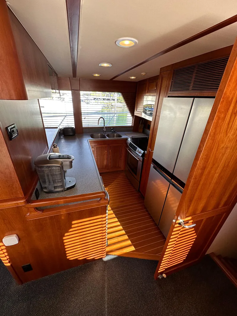 Slide: The Image of 2009 Little Hoquiam 68 Long Range Sportfisher kitchen with modern appliances and wood finish. - 28