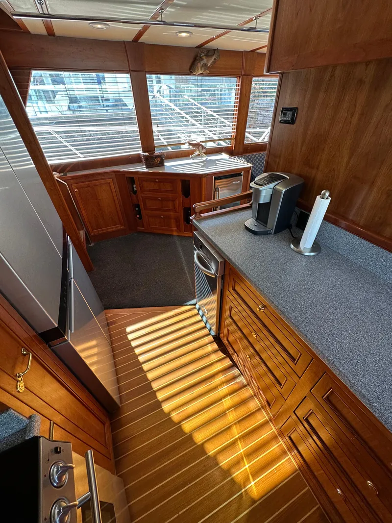 Slide: The Image of 2009 Little Hoquiam 68 Long Range Sportfisher kitchen with wood cabinetry and modern appliances. - 32