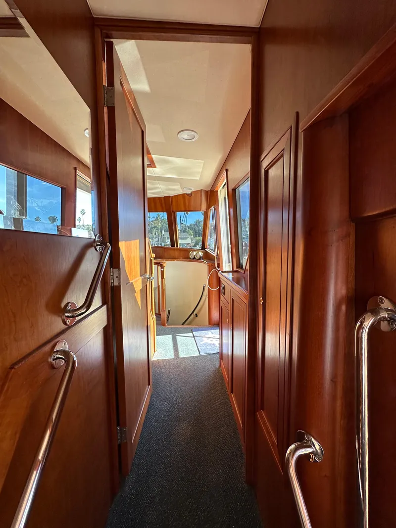Slide: The Image of Interior hallway of 2009 Little Hoquiam 68 Long Range Sportfisher yacht with wooden finishes. - 35