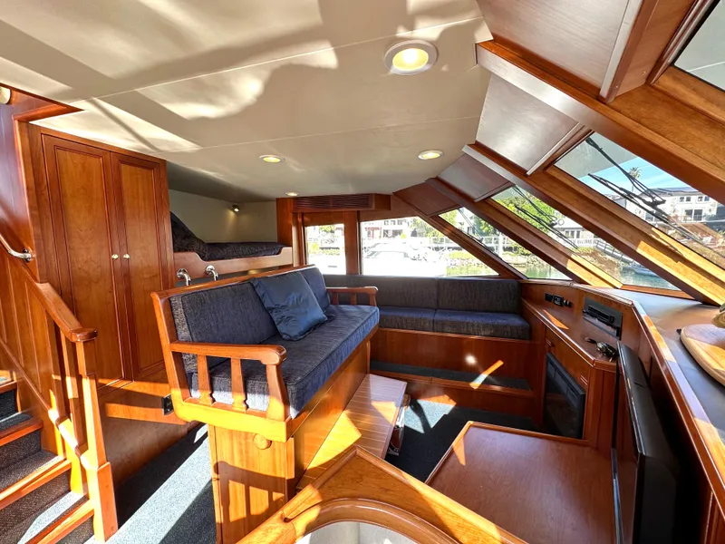 Slide: The Image of Interior of 2009 Little Hoquiam 68 Long Range Sportfisher with wooden furnishings and large windows. - 38