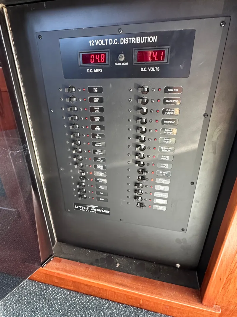 Slide: The Image of 12-volt DC distribution panel on a 2009 Little Hoquiam 68 Long Range Sportfisher. - 49