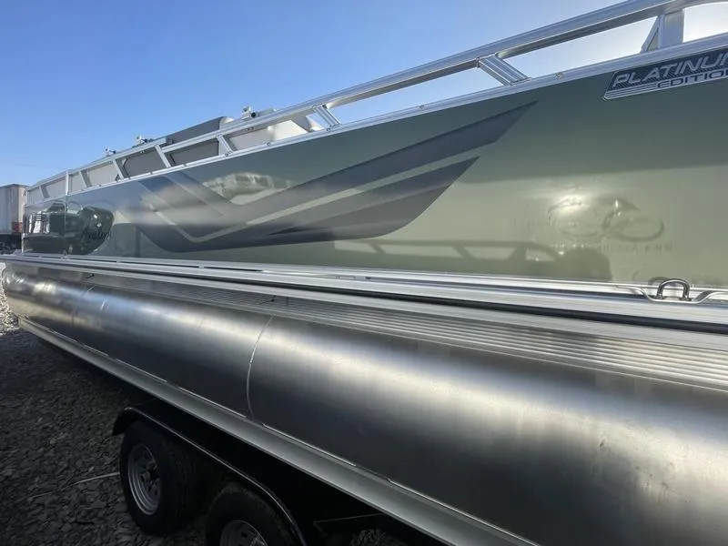 Slide: The Image of 2024 Avalon VENTURE 85 ELITE WINDSHIELD pontoon boat, side view, Platinum Edition. - 2
