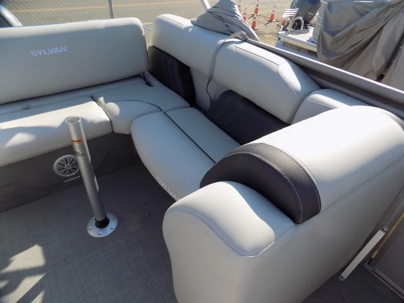 Slide: The Image of 2024 Sylvan Mirage 8522 CLZ boat interior with luxurious seating. - 6