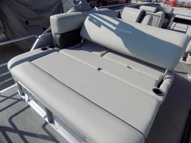 Slide: The Image of 2024 Sylvan Mirage 8522 CLZ boat with spacious seating and cup holders. - 9