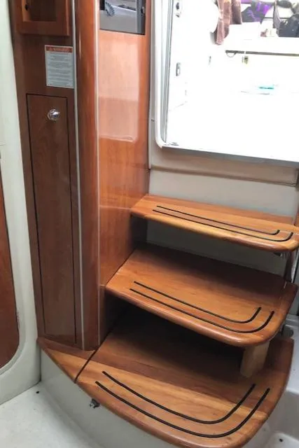 Slide: The Image of 2004 Doral Intrique boat interior wooden steps. - 13