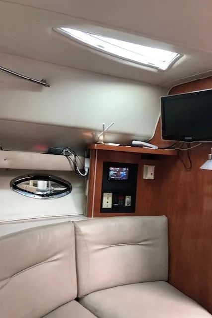 Slide: The Image of Interior of 2004 Doral Intrique boat with TV, seating, and skylight. - 15