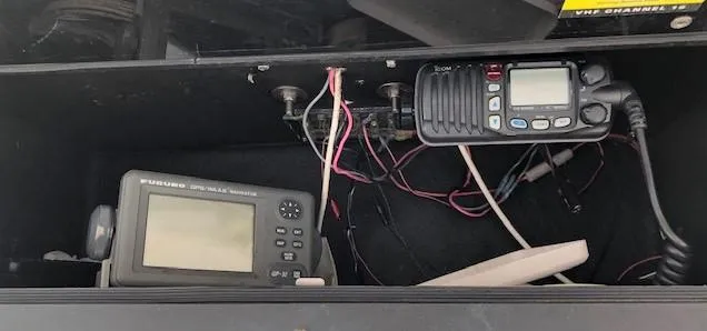 Slide: The Image of Electronics panel in 2003 Carolina Classic 25 I/O boat with radio and navigation devices. - 23