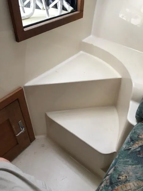 Slide: The Image of Interior steps of a 2003 Carolina Classic 25 I/O boat, featuring a compact design. - 31