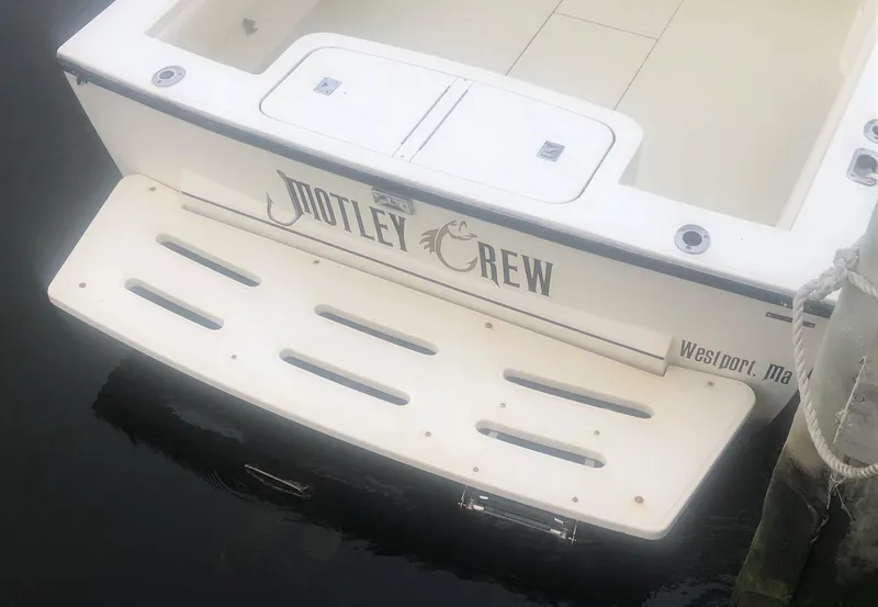 Slide: The Image of 2003 Carolina Classic 25 I/O boat with "Motley Crew" name, docked in Westport, MA. - 33