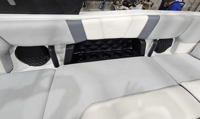 Slide: The Image of 2024 Malibu 21 LX-R boat interior seating with cup holders. - 10