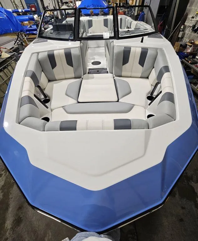 Slide: The Image of 2024 Malibu 21 LX-R boat with spacious seating and modern design. - 4
