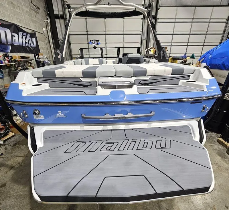 Slide: The Image of 2024 Malibu 21 LX-R boat rear view in a garage. - 9