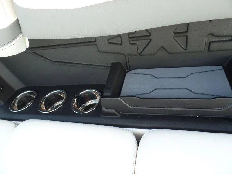 Slide: The Image of 2024 Axis A245 interior with cup holders and storage compartment. - 11