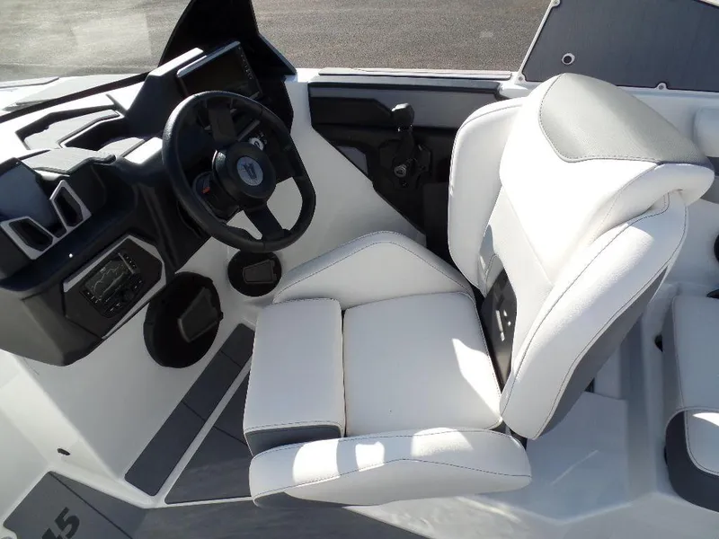 Slide: The Image of 2024 Axis A245 boat interior with white seating and modern dashboard. - 12