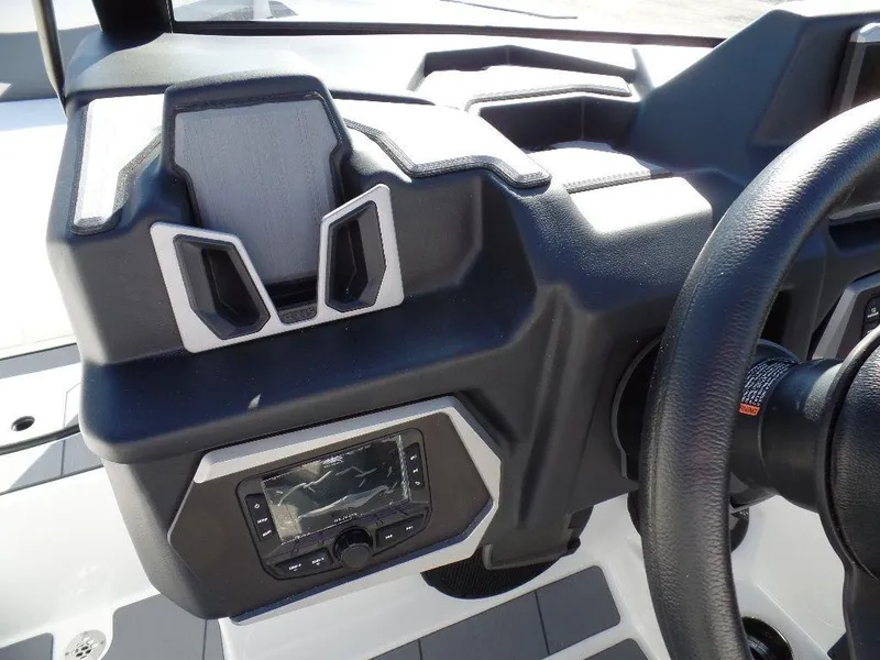 Slide: The Image of 2024 Axis A245 boat dashboard with steering wheel and control panel. - 15