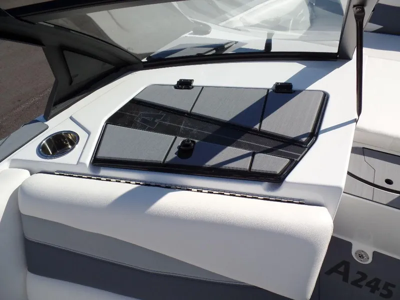 Slide: The Image of 2024 Axis A245 boat interior with sleek dashboard and cup holder. - 16