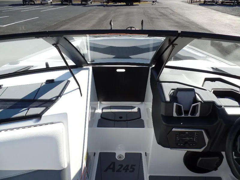 Slide: The Image of 2024 Axis A245 boat interior with modern dashboard and seating. - 17