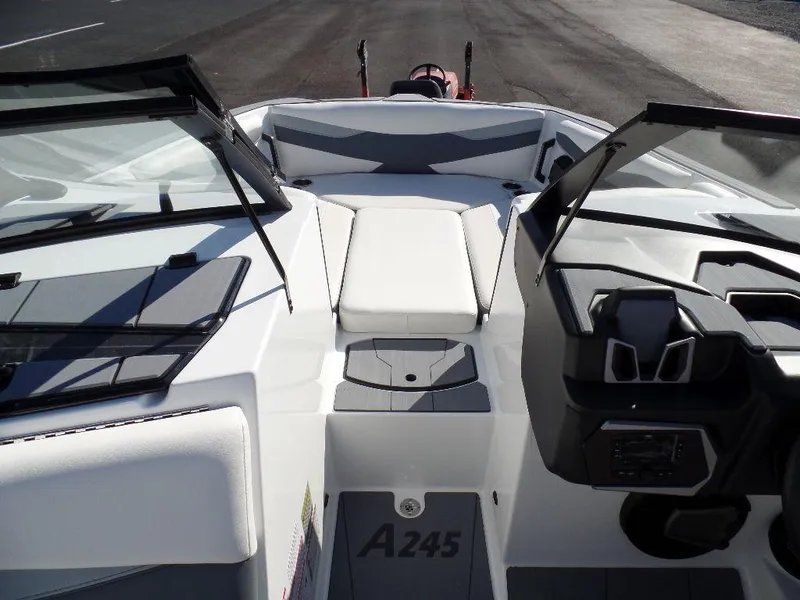 Slide: The Image of 2024 Axis A245 boat interior with sleek design and modern dashboard features. - 18