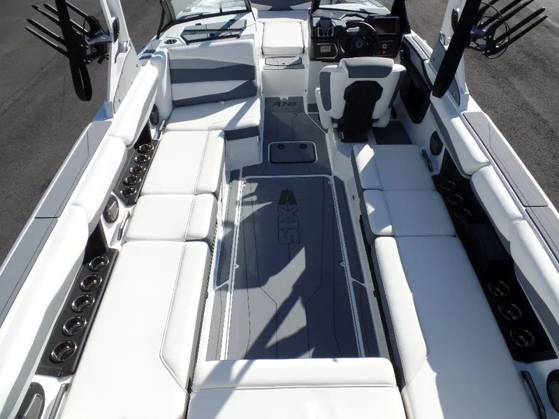 Slide: The Image of 2024 Axis A245 boat interior with white seating and modern dashboard design. - 22