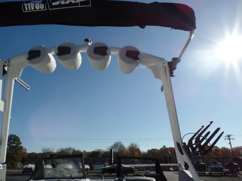 Slide: The Image of 2024 Axis A245 boat tower with speakers under clear blue sky. - 25