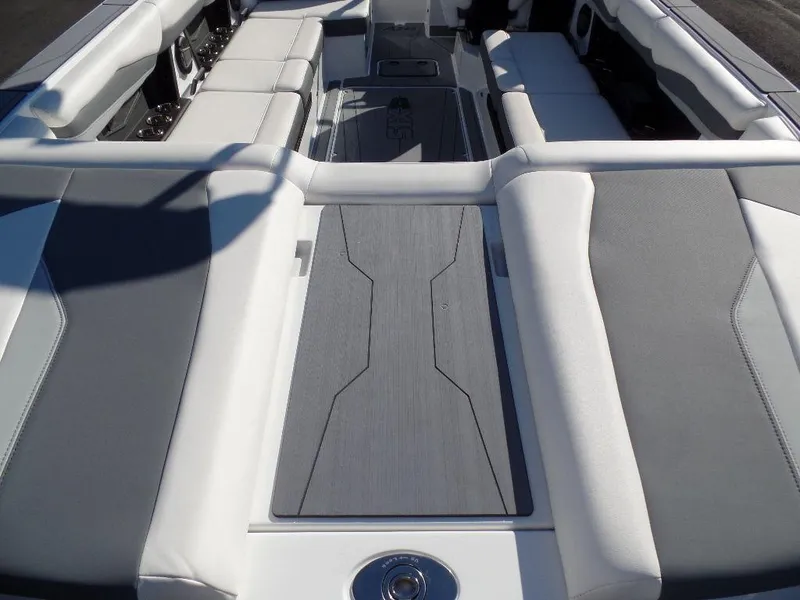 Slide: The Image of 2024 Axis A245 boat interior with sleek gray and white seating design. - 4