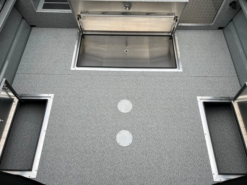 Slide: The Image of 2024 Spartan 215 Athens boat storage compartments and deck. - 10