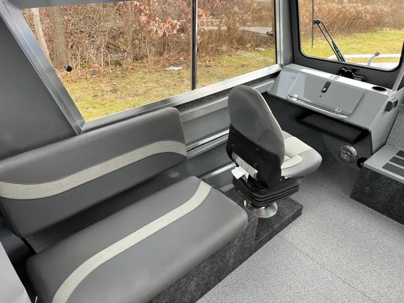 Slide: The Image of 2024 Spartan 215 Athens boat interior with gray seating and modern design. - 6