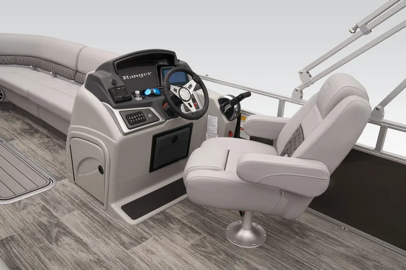 Slide: The Image of 2024 Ranger Reata 223C boat interior with captain's chair and control console. - 37
