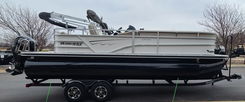 Slide: The Image of 2024 Ranger Reata 223C pontoon boat on a trailer. - 5