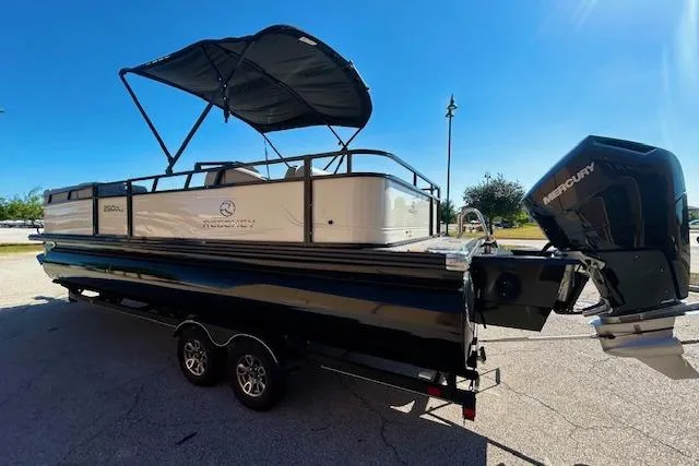 Slide: The Image of 2024 Regency 250 DL3 pontoon boat with canopy at boat service center. - 2