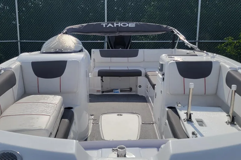 Slide: The Image of 2024 Tahoe 2150 boat interior with seating and canopy, showcasing modern design. - 2