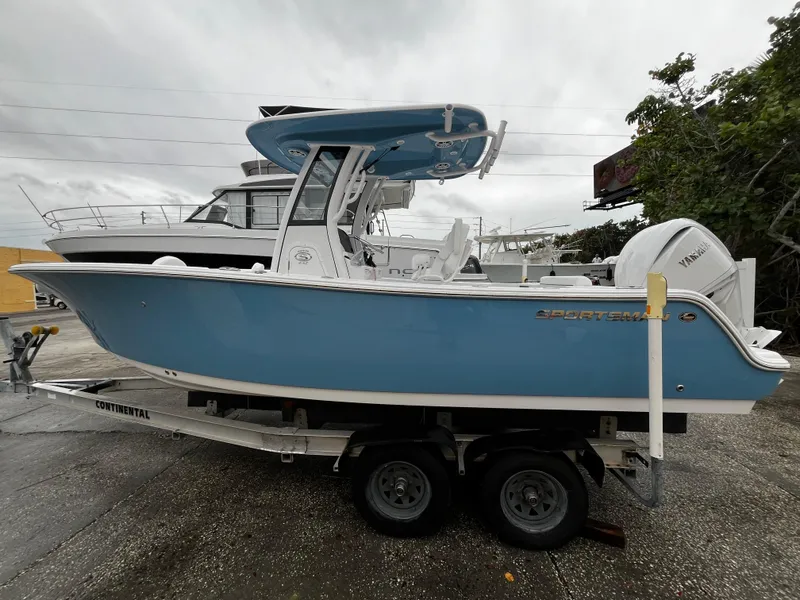 Slide: The Image of 2024 Sportsman Open 232 Center Console boat on trailer. - 0