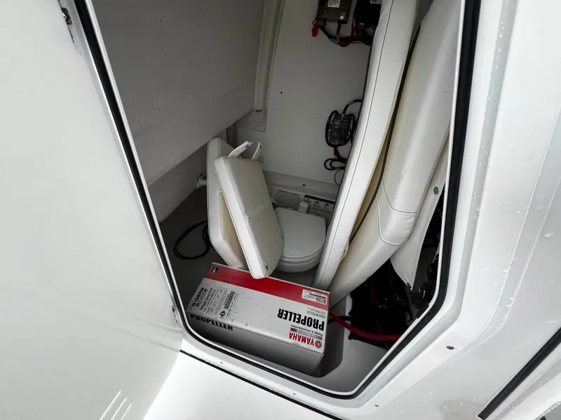 Slide: The Image of 2024 Sportsman Open 232 Center Console interior storage compartment with Yamaha propeller box. - 20