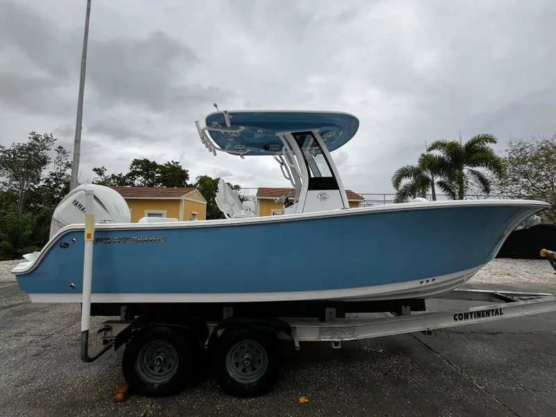 Slide: The Image of 2024 Sportsman Open 232 Center Console boat on trailer, side view. - 3