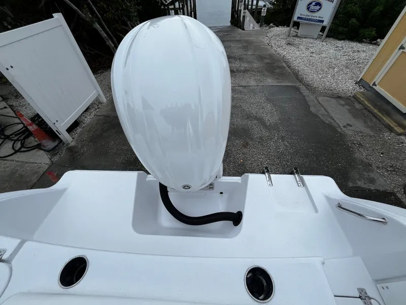 Slide: The Image of 2024 Sportsman Open 232 Center Console boat engine at dock. - 7