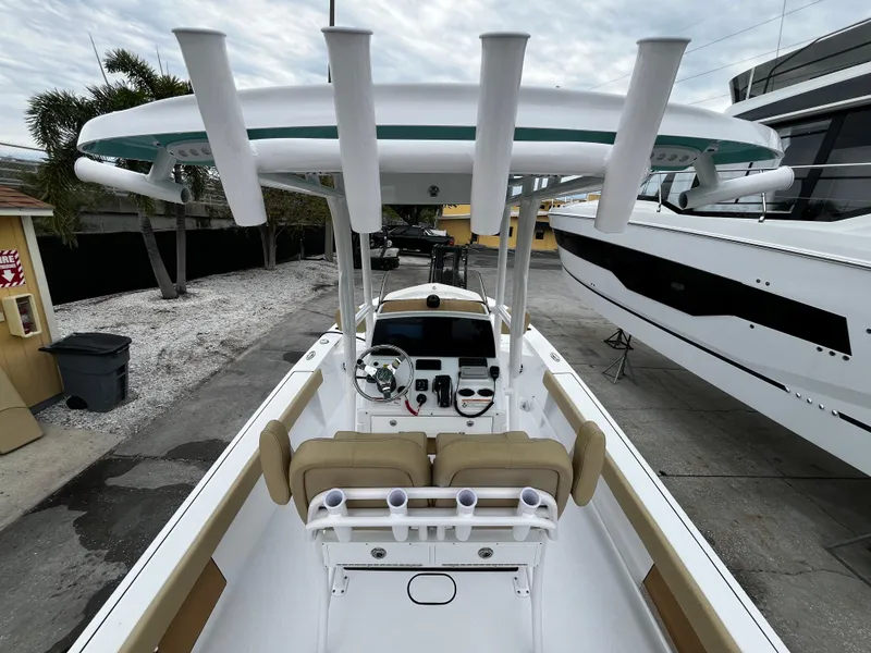 Slide: The Image of 2024 Sportsman Masters 227 Bay Boat with center console and rod holders. - 10