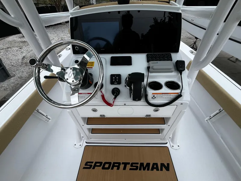 Slide: The Image of Console of a 2024 Sportsman Masters 227 Bay Boat with steering wheel and controls. - 12
