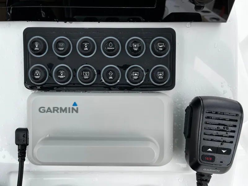 Slide: The Image of Control panel of 2024 Sportsman Masters 227 Bay Boat with Garmin electronics. - 13
