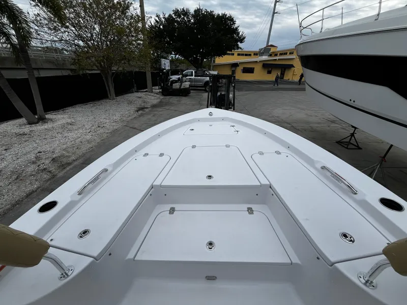 Slide: The Image of 2024 Sportsman Masters 227 Bay Boat bow view at dock. - 19