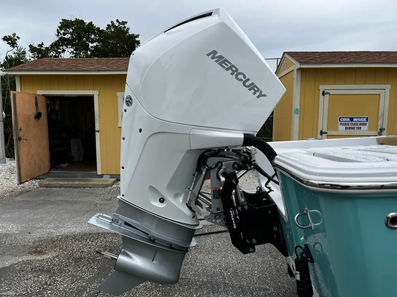 Slide: The Image of 2024 Sportsman Masters 227 Bay Boat with Mercury outboard motor. - 5