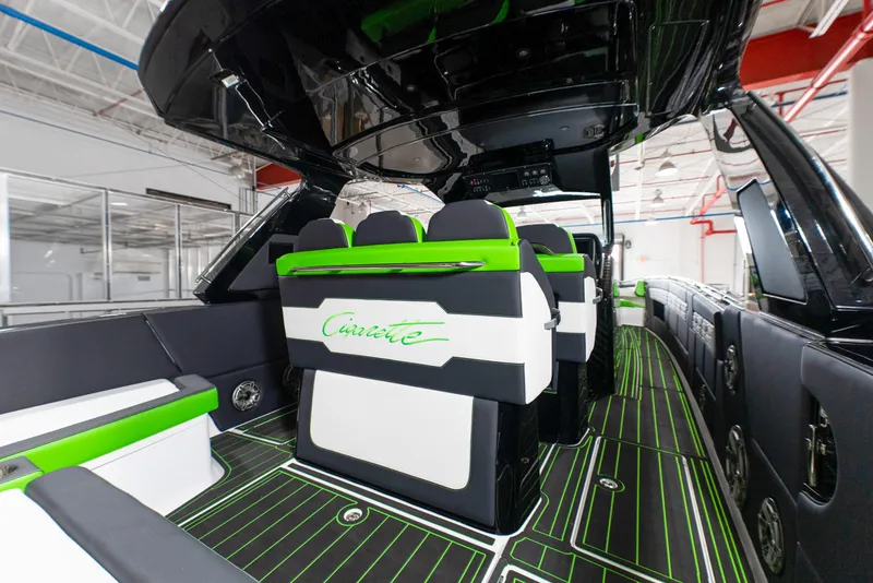 Slide: The Image of 2025 Cigarette 42 Auroris luxury boat interior with green and black seating. - 13