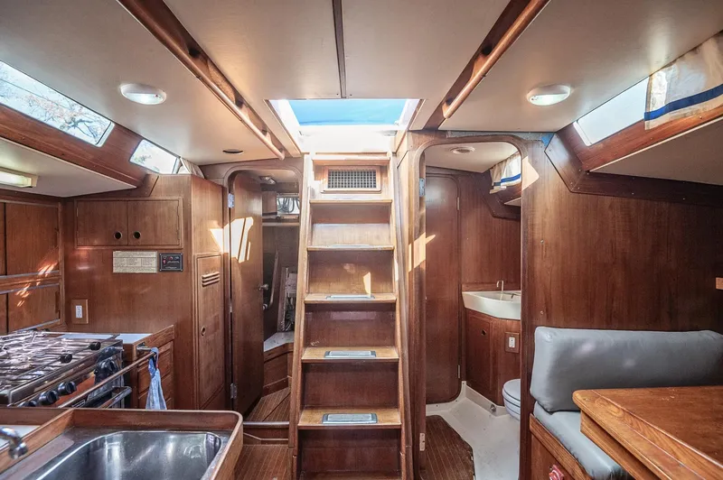 Slide: The Image of Interior of a 1977 Baltic 42 sailboat with wooden finishes and skylights. - 12