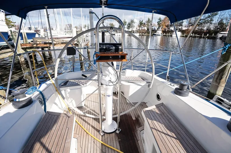 Slide: The Image of Cockpit of a 1977 Baltic 42 sailboat with wooden deck and steering wheel. - 17