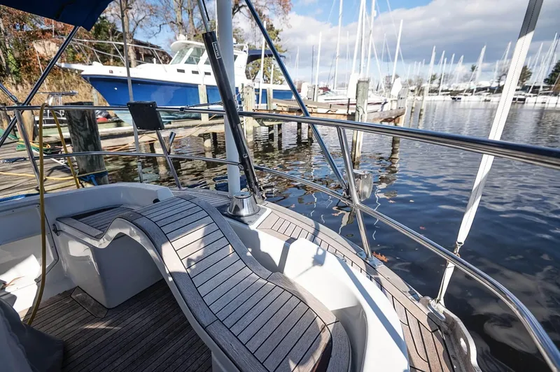 Slide: The Image of Cockpit view of a 1977 Baltic 42 sailboat docked at a marina. - 18