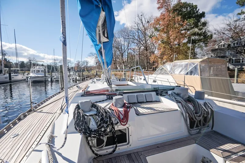 Slide: The Image of Sailboat Baltic 42, 1977 model, docked in a marina with clear skies. - 19
