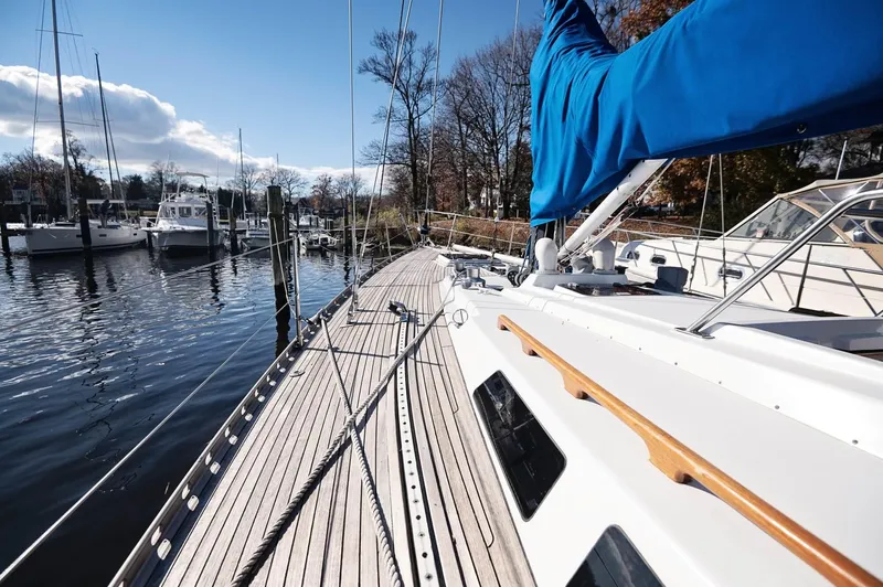 Slide: The Image of Sailboat docked at marina, Baltic 42 model, 1977, with blue sail cover. - 24